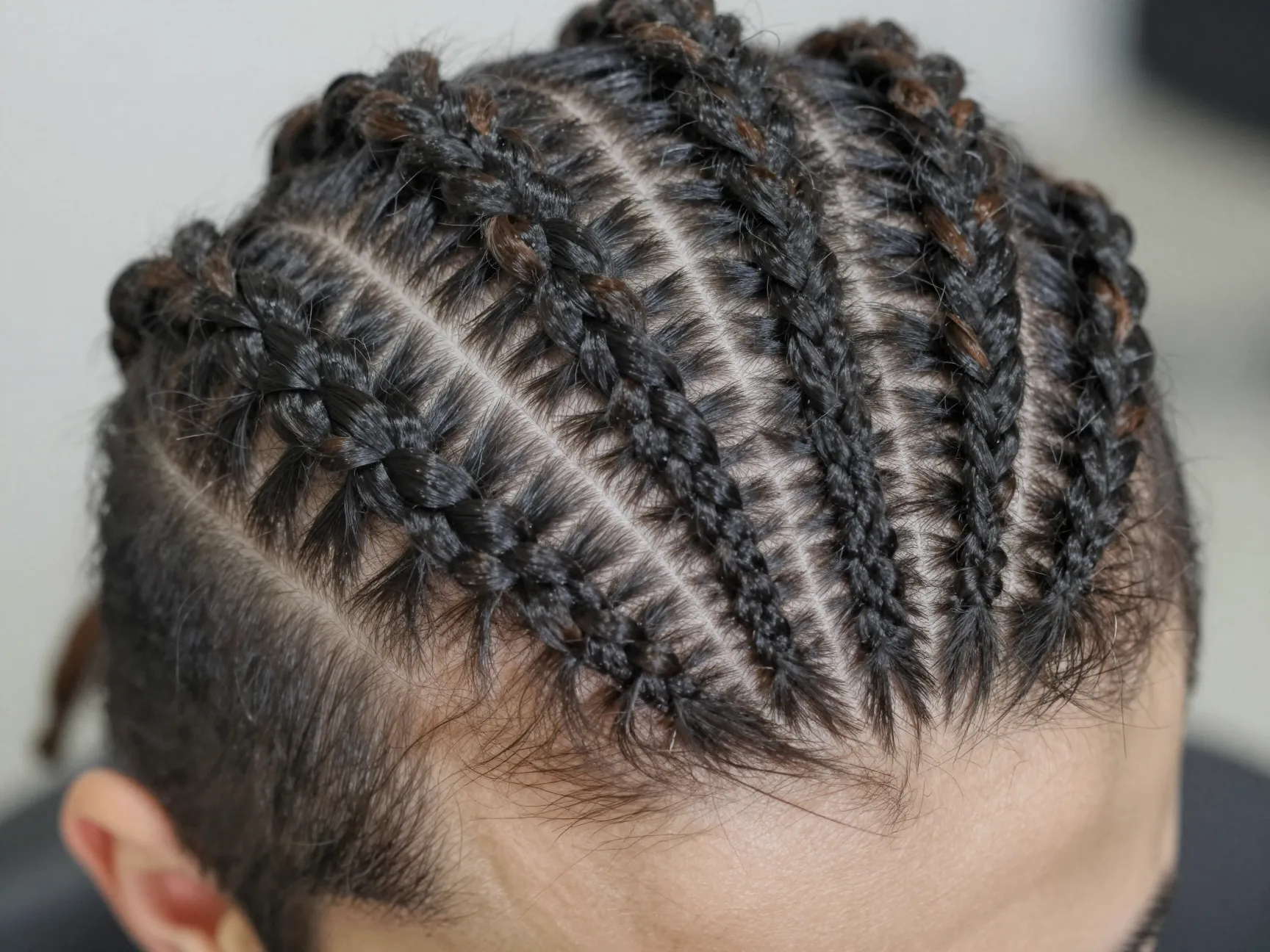 Zig zag part cornrows with soft unraveled braid ends