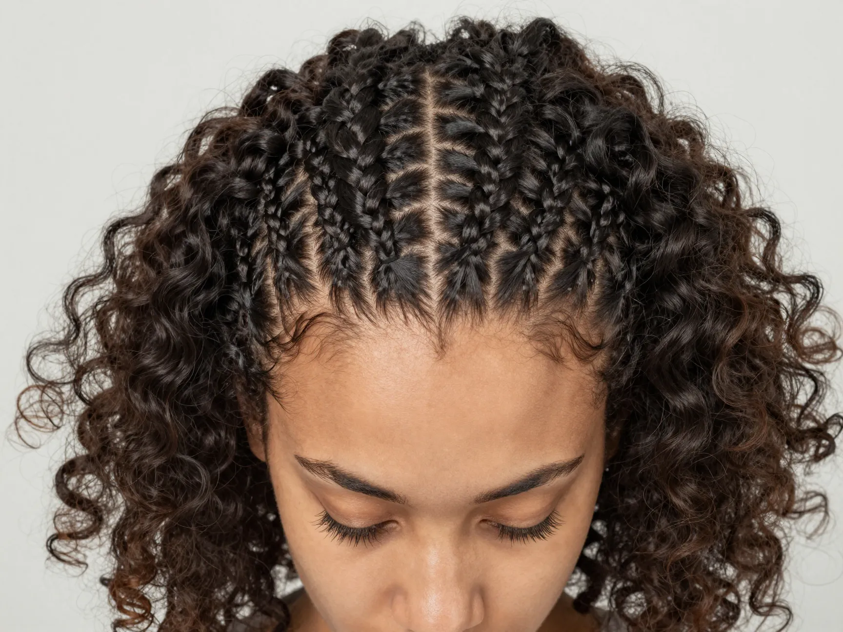 Braided hairline cornrow with free natural curls flow