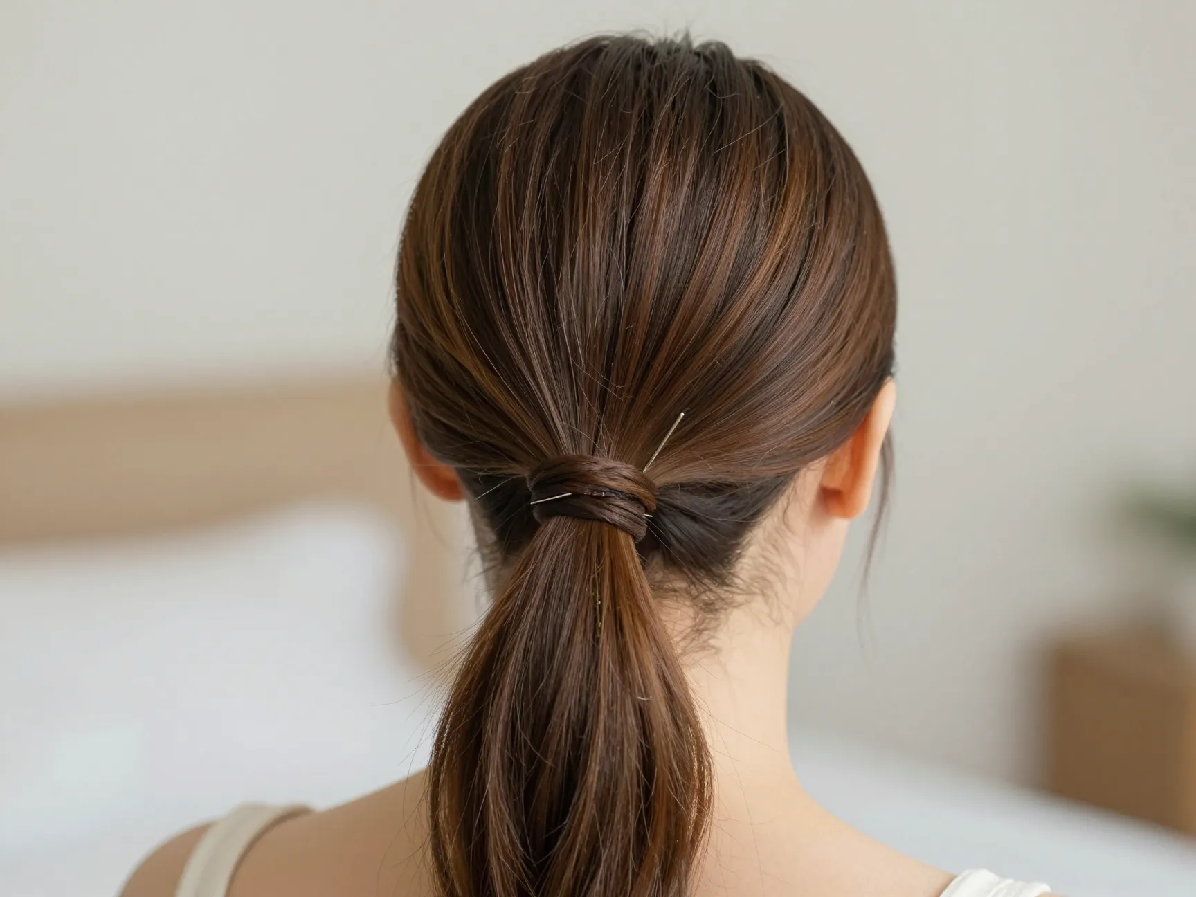 Polished wrapped ponytail with hidden tie and bobby pins