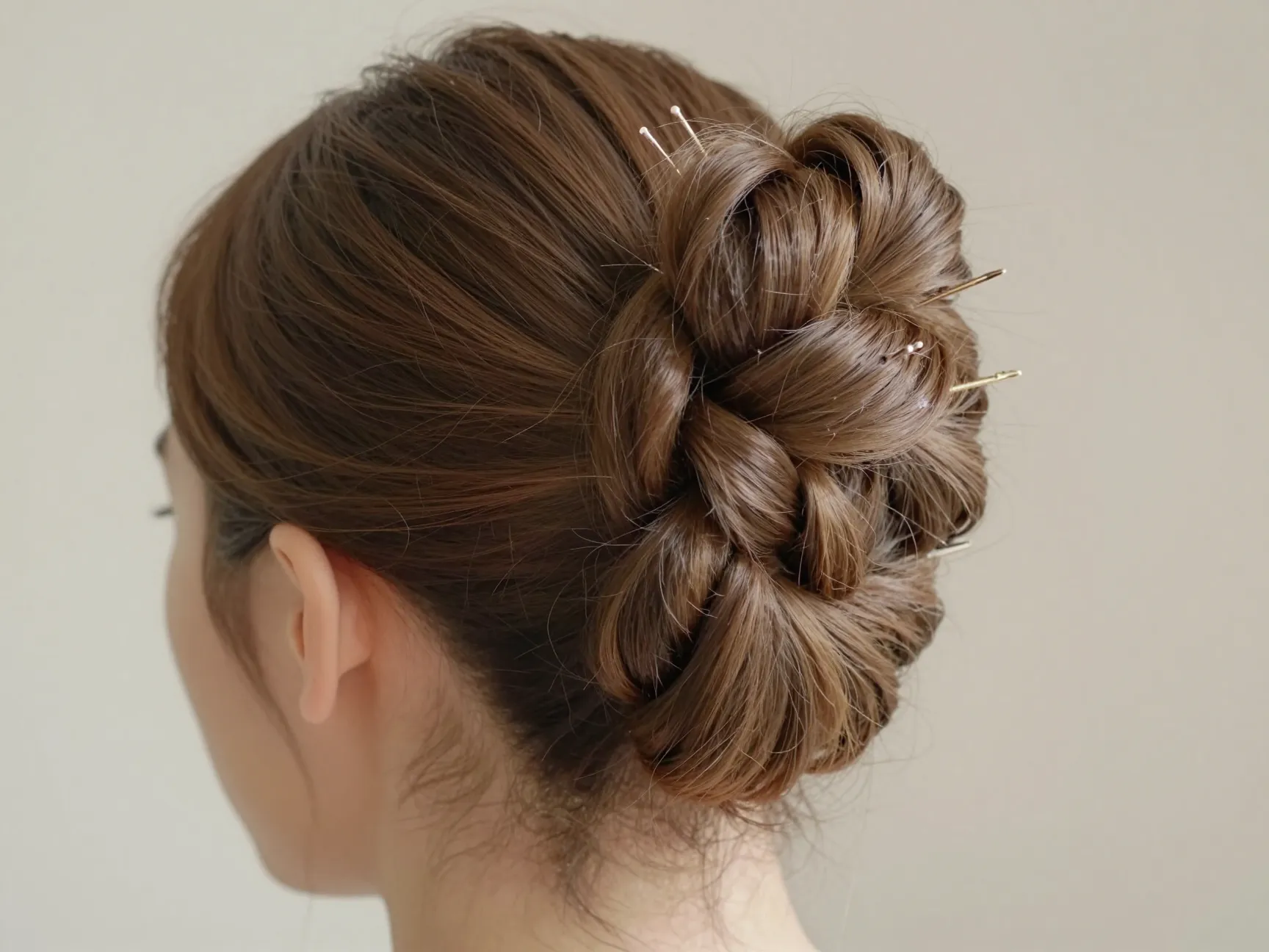 Elegant twisted ballerina bun secured with styling paste