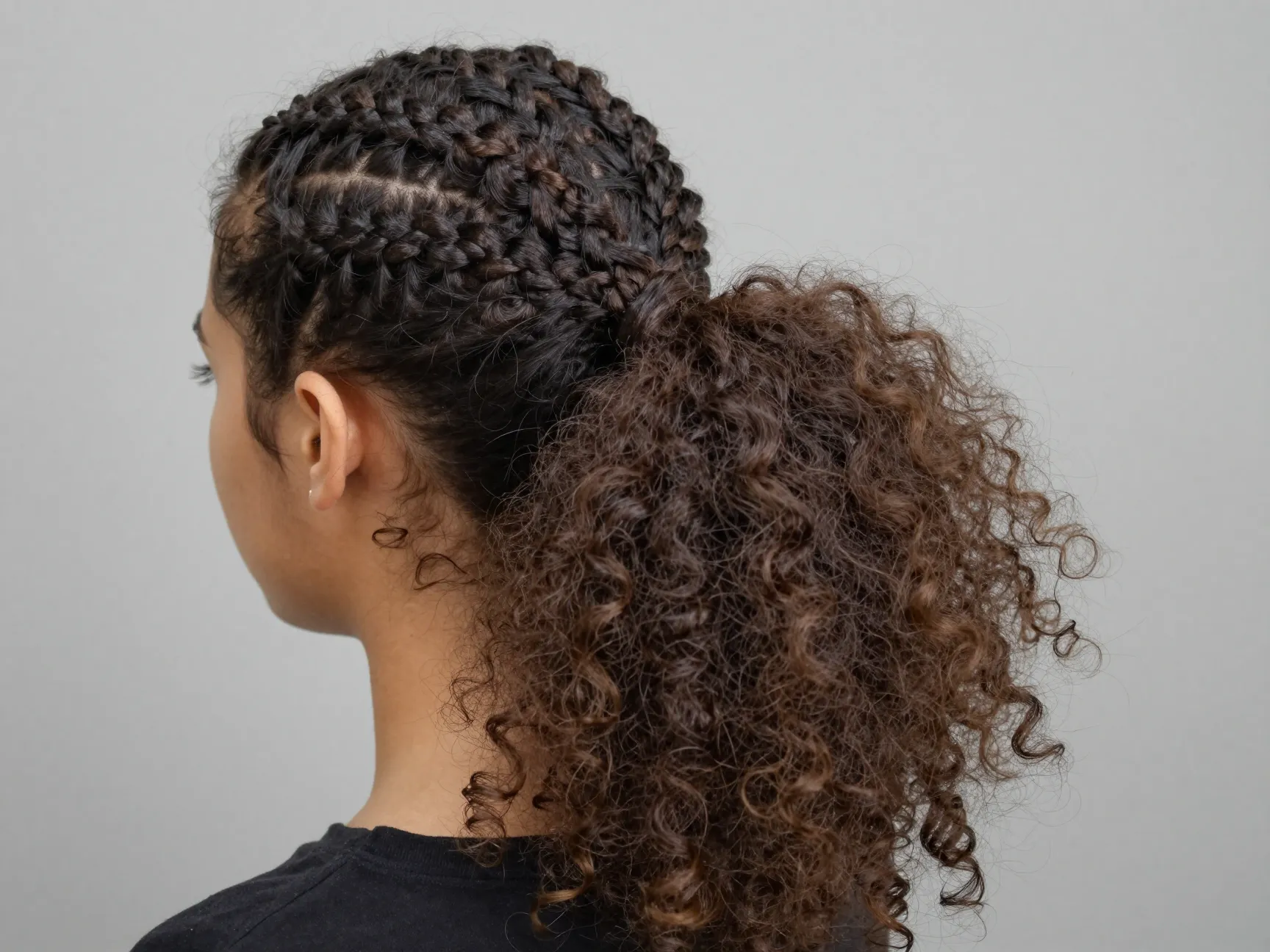 Cornrow ponytail all back with voluminous curly puff end