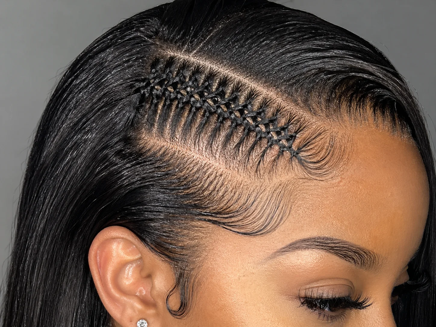 Zipper braid interlocking pattern hugging scalp on one side