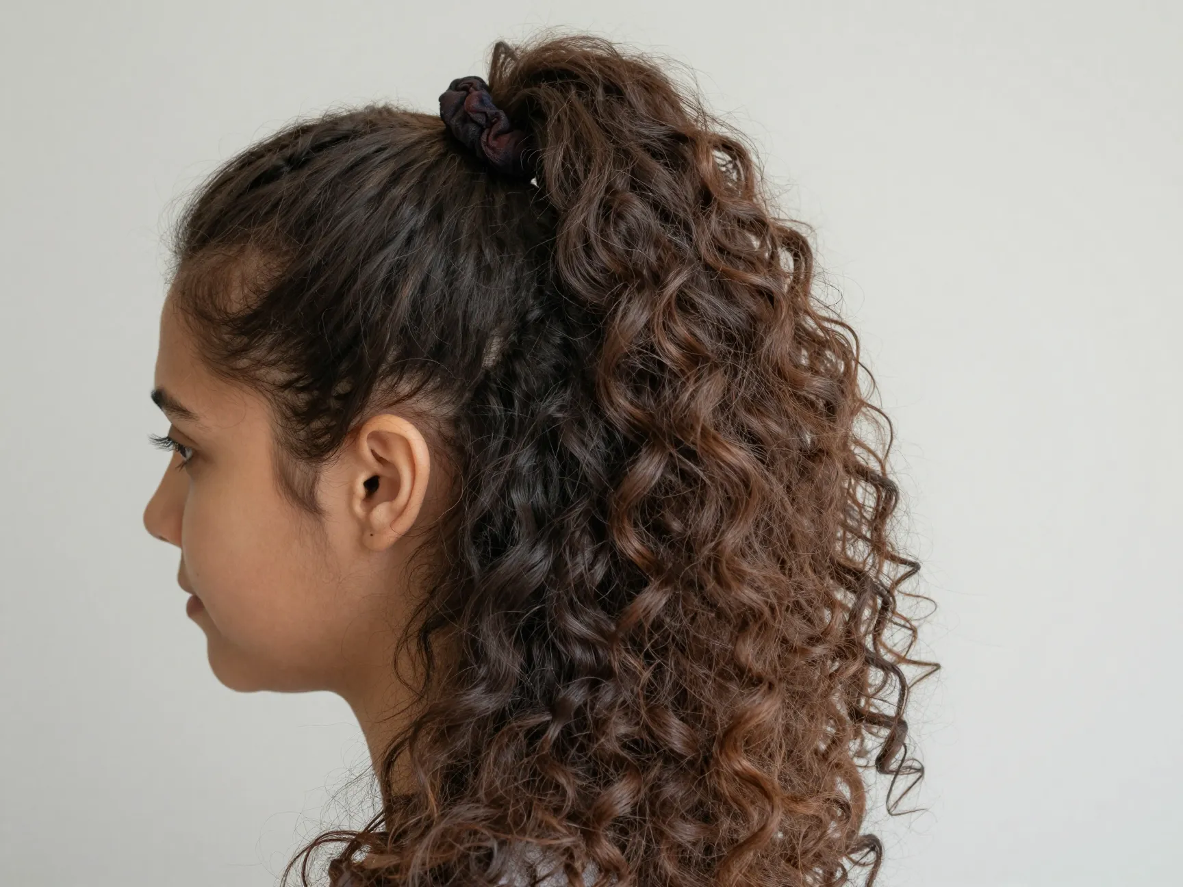 Voluminous half up half down twist with inverted threading technique
