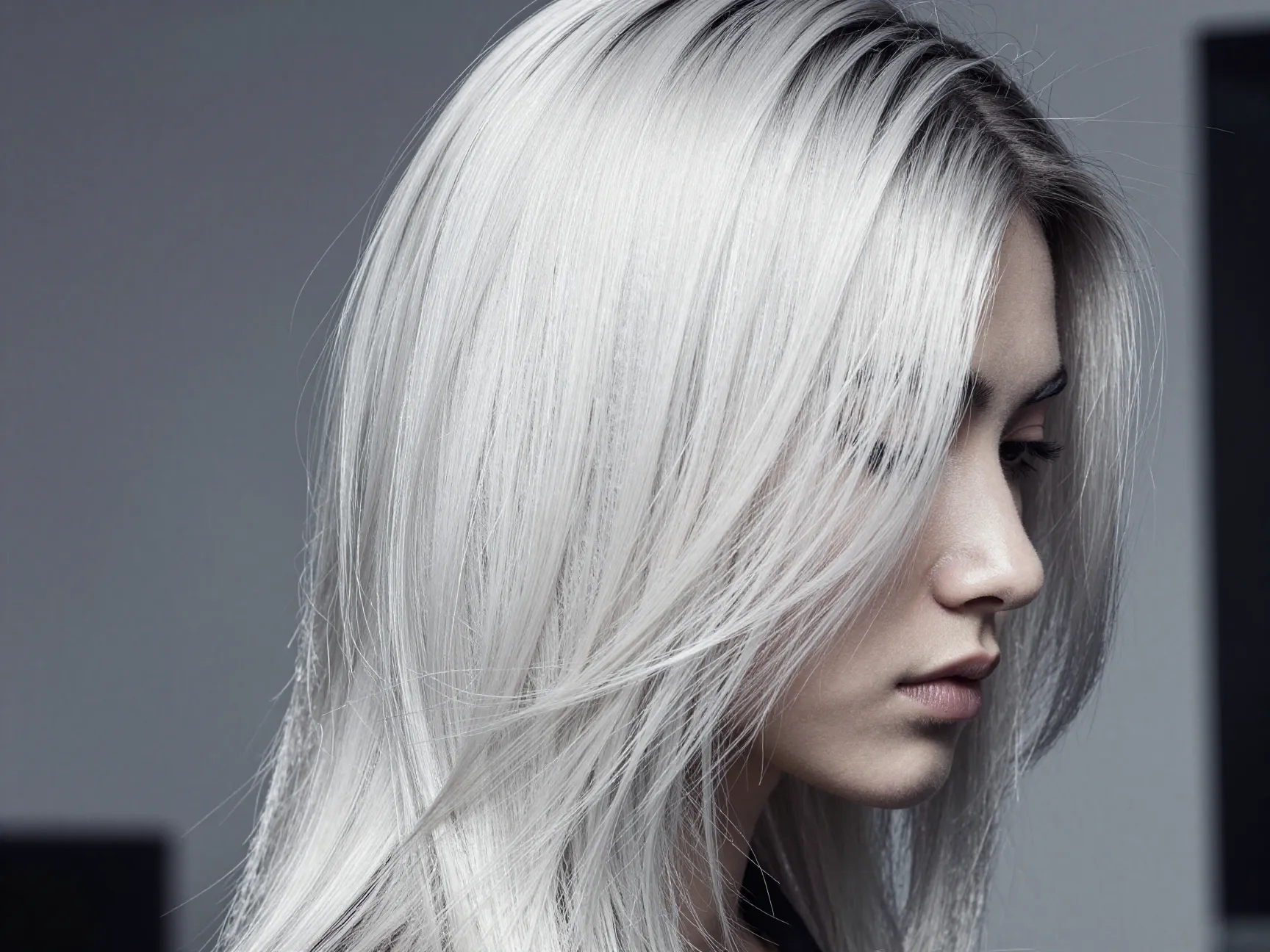 Platinum blonde hair with dark root shadow edgy look