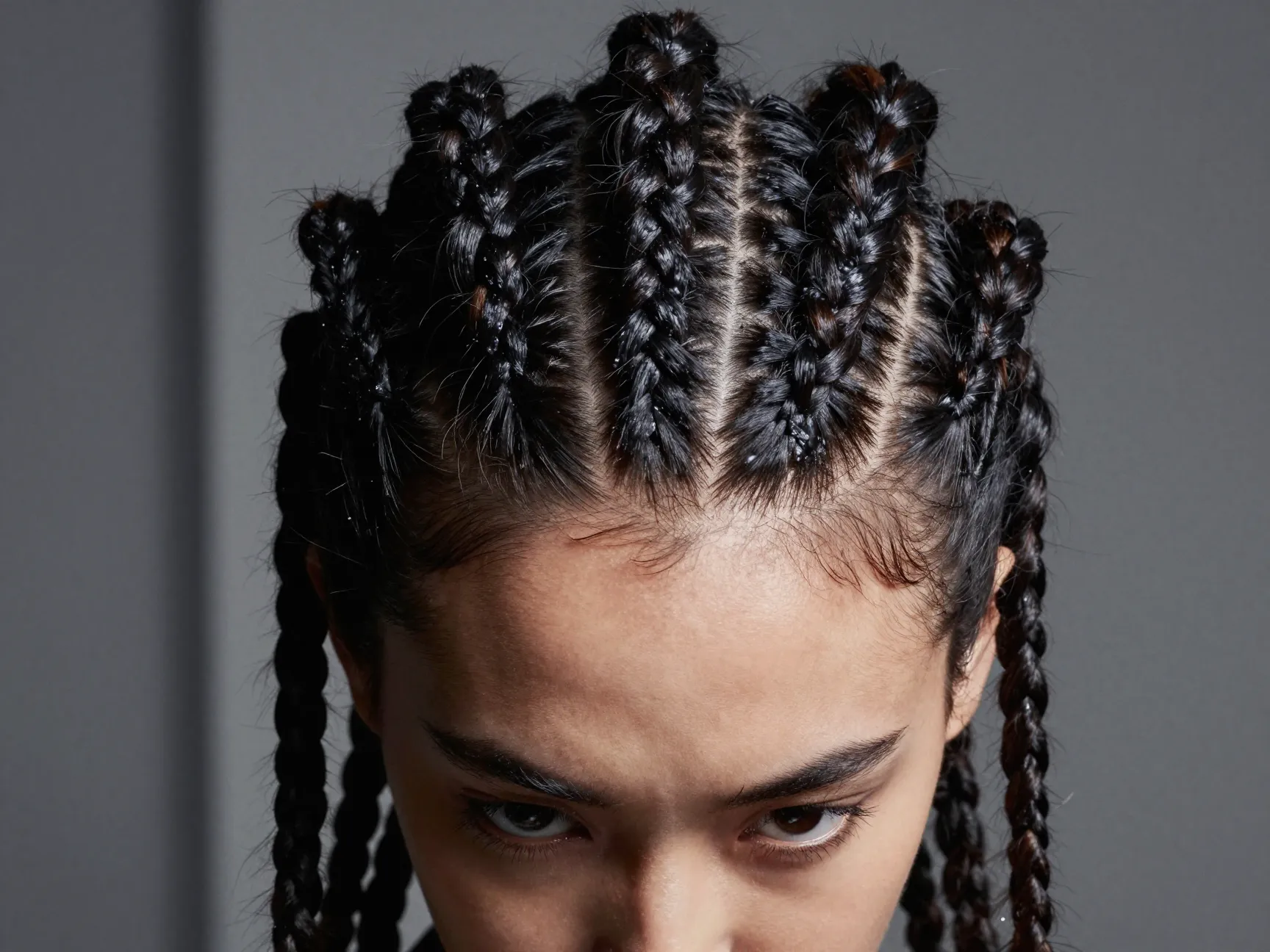 Bold jumbo straight back cornrows in a wide section hairstyle