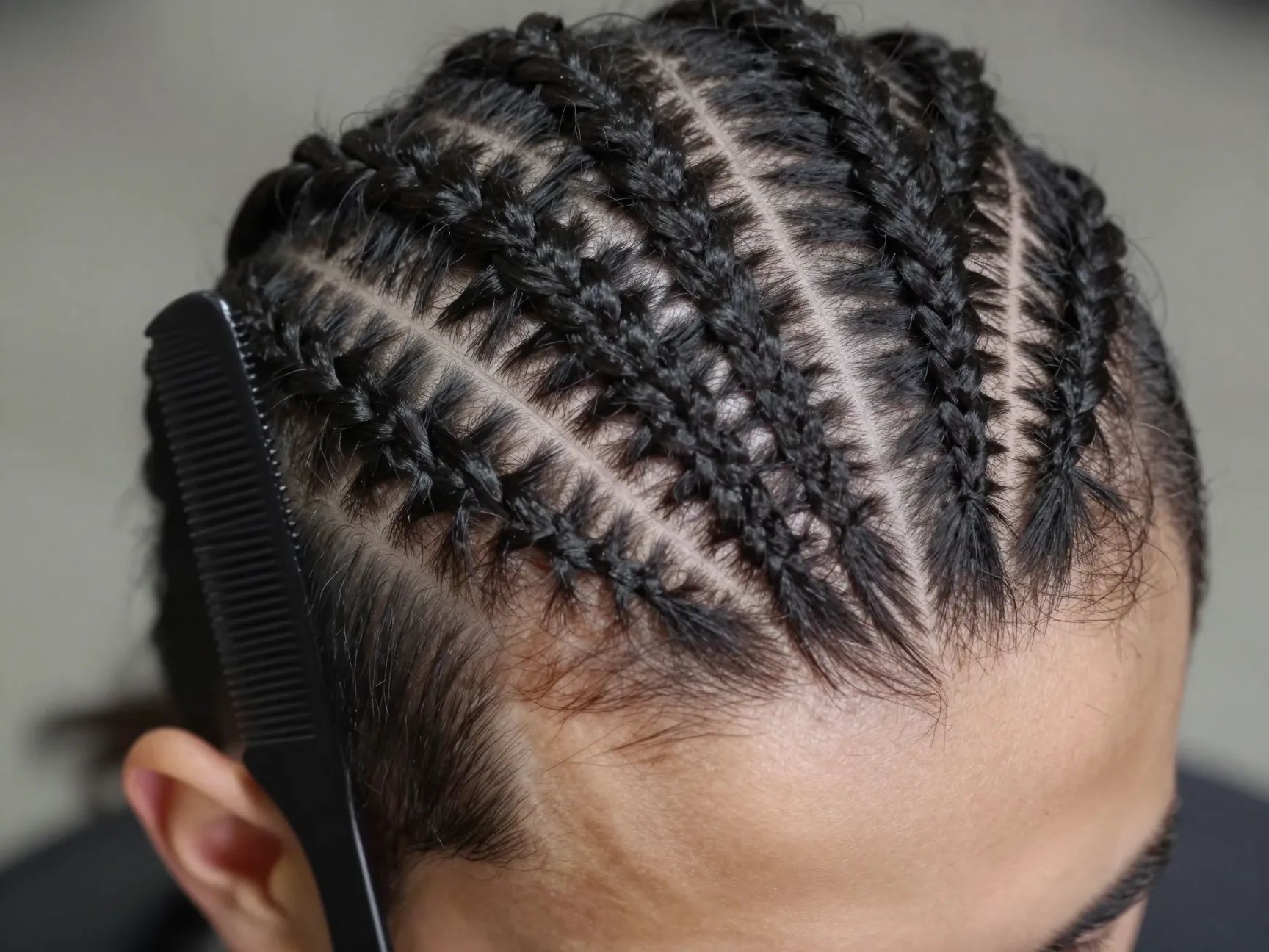 Geometric zigzag part lines scalp before cornrow braiding
