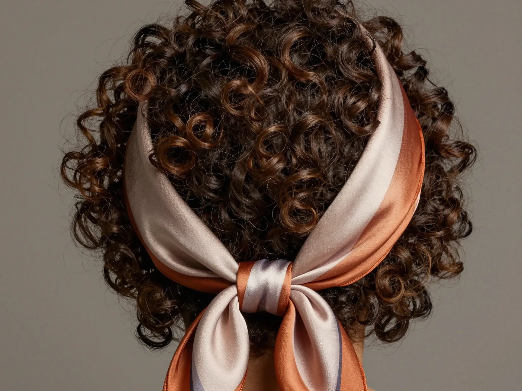 High puff with scarf wrap on curly hair at crown