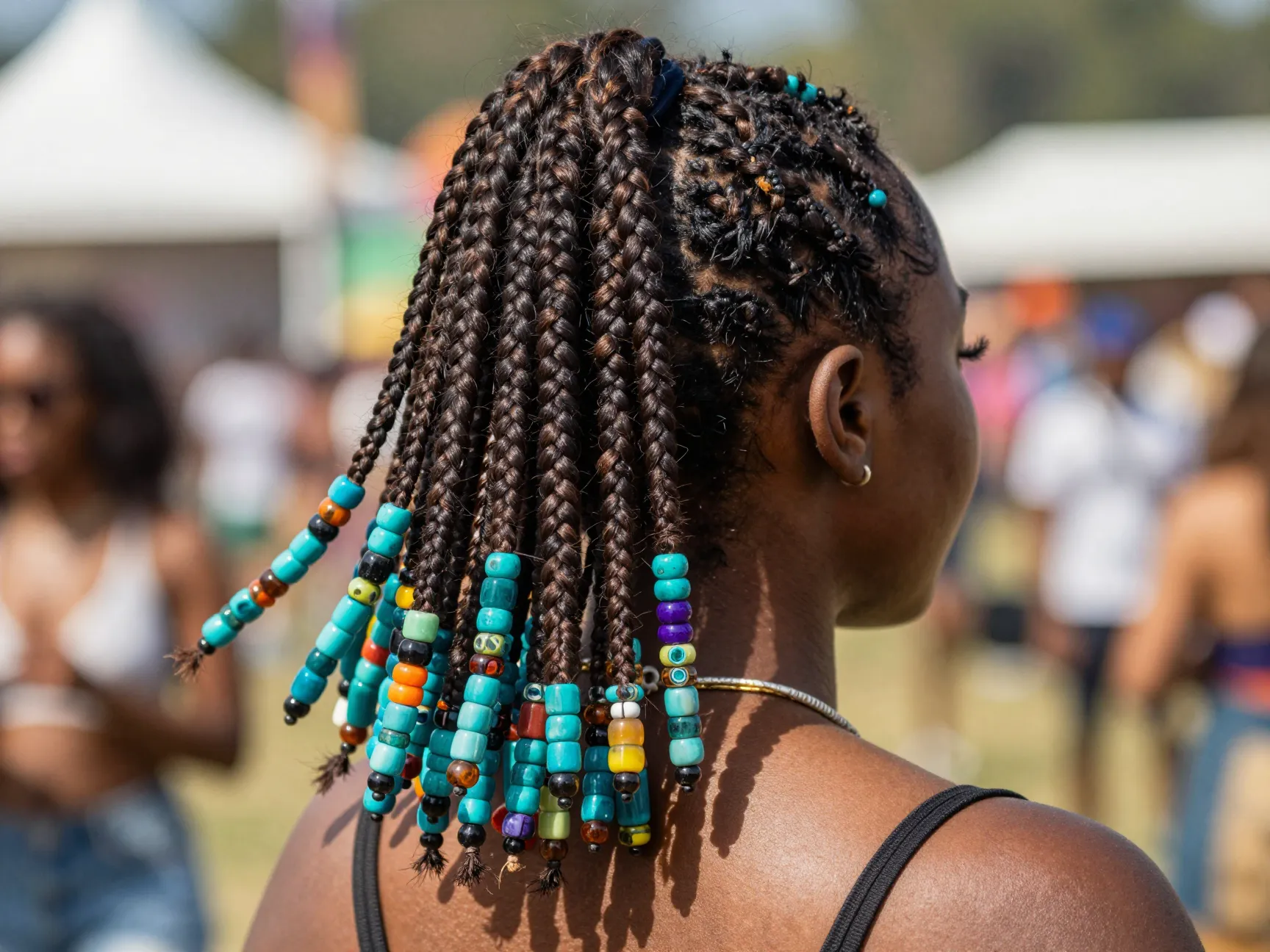 Traditional beaded cornrow ponytail with colorful acrylic beads