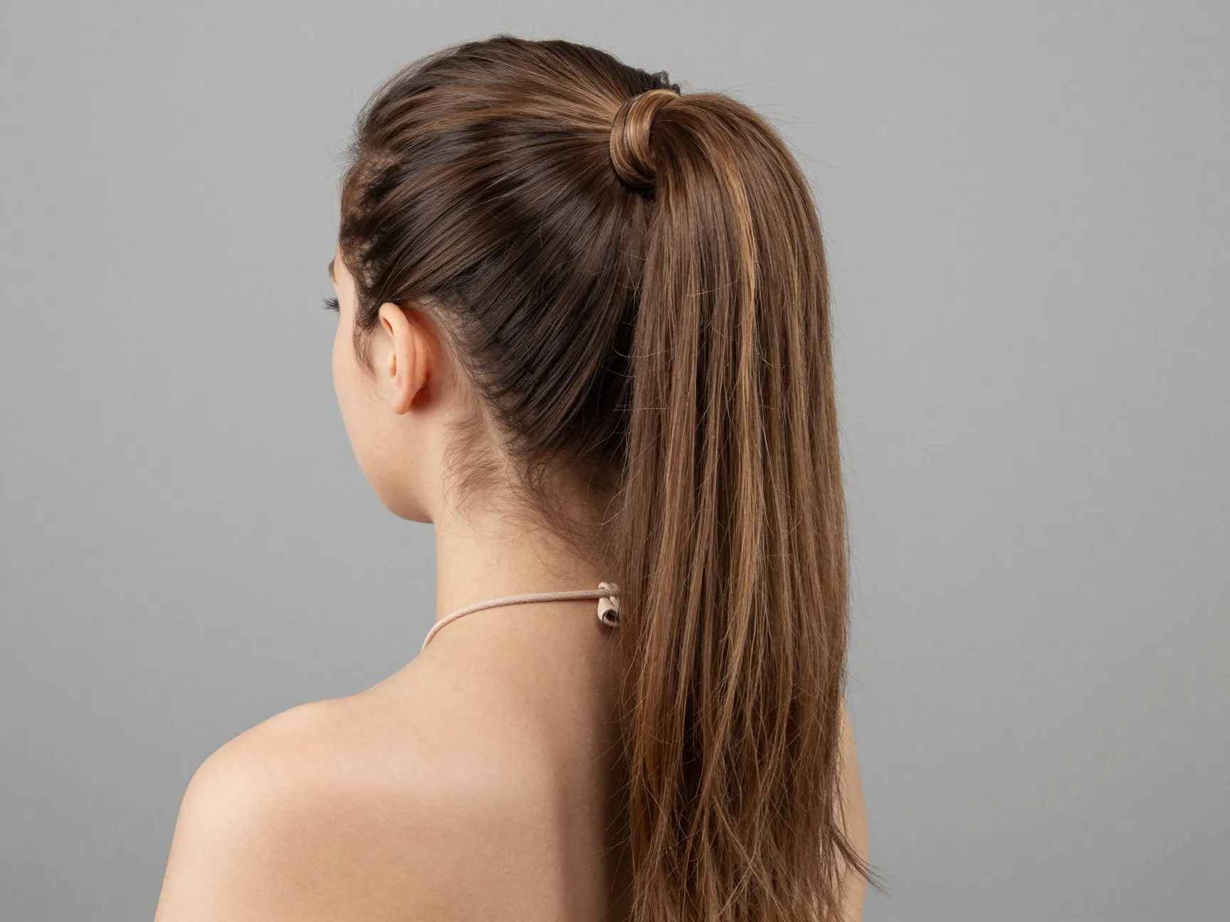 Faux low ponytail using a drawstring ponytail extension