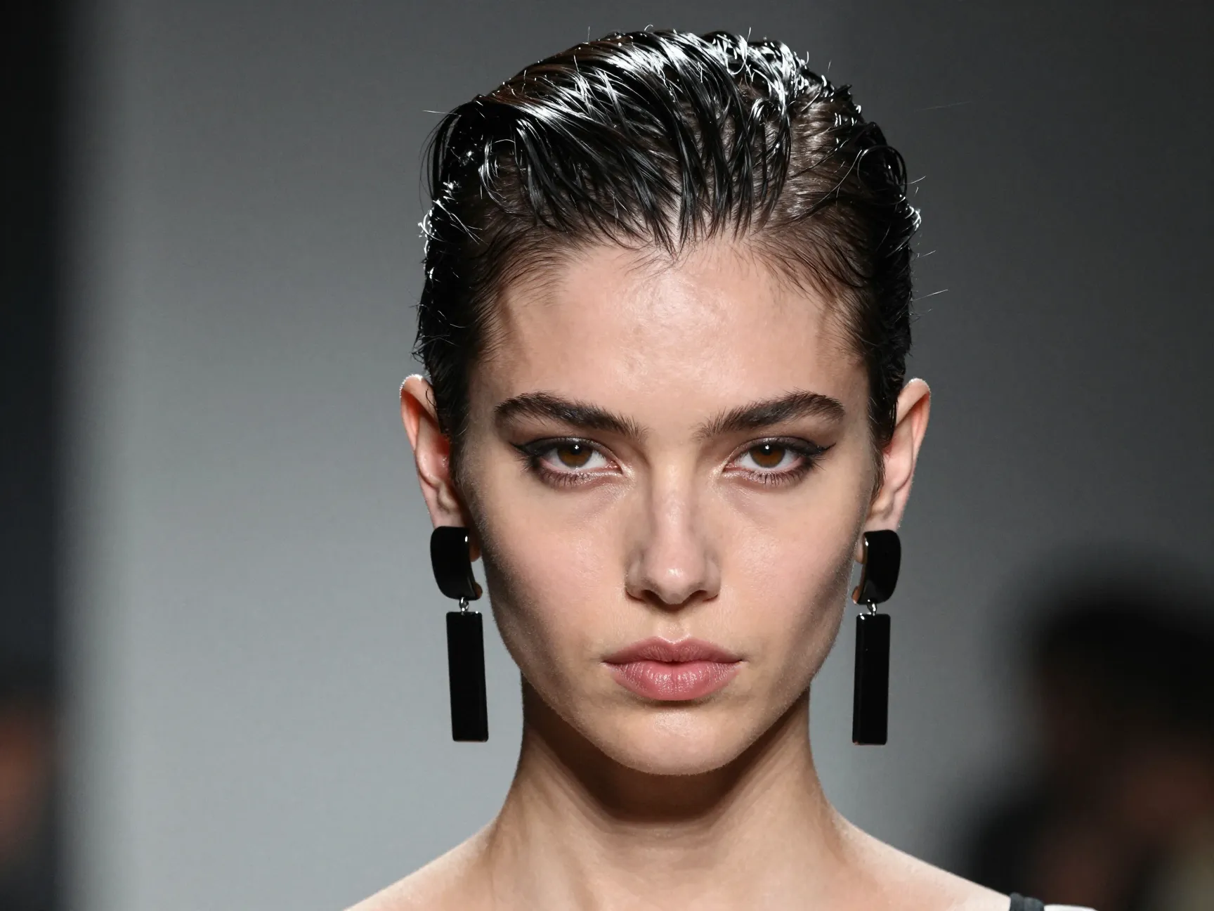 Slicked back pixie strong hold gel lacquered streamlined bold earrings