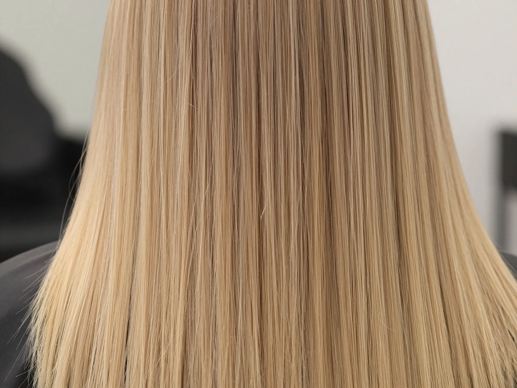 Blunt long cut straight across hemline on fine thin hair