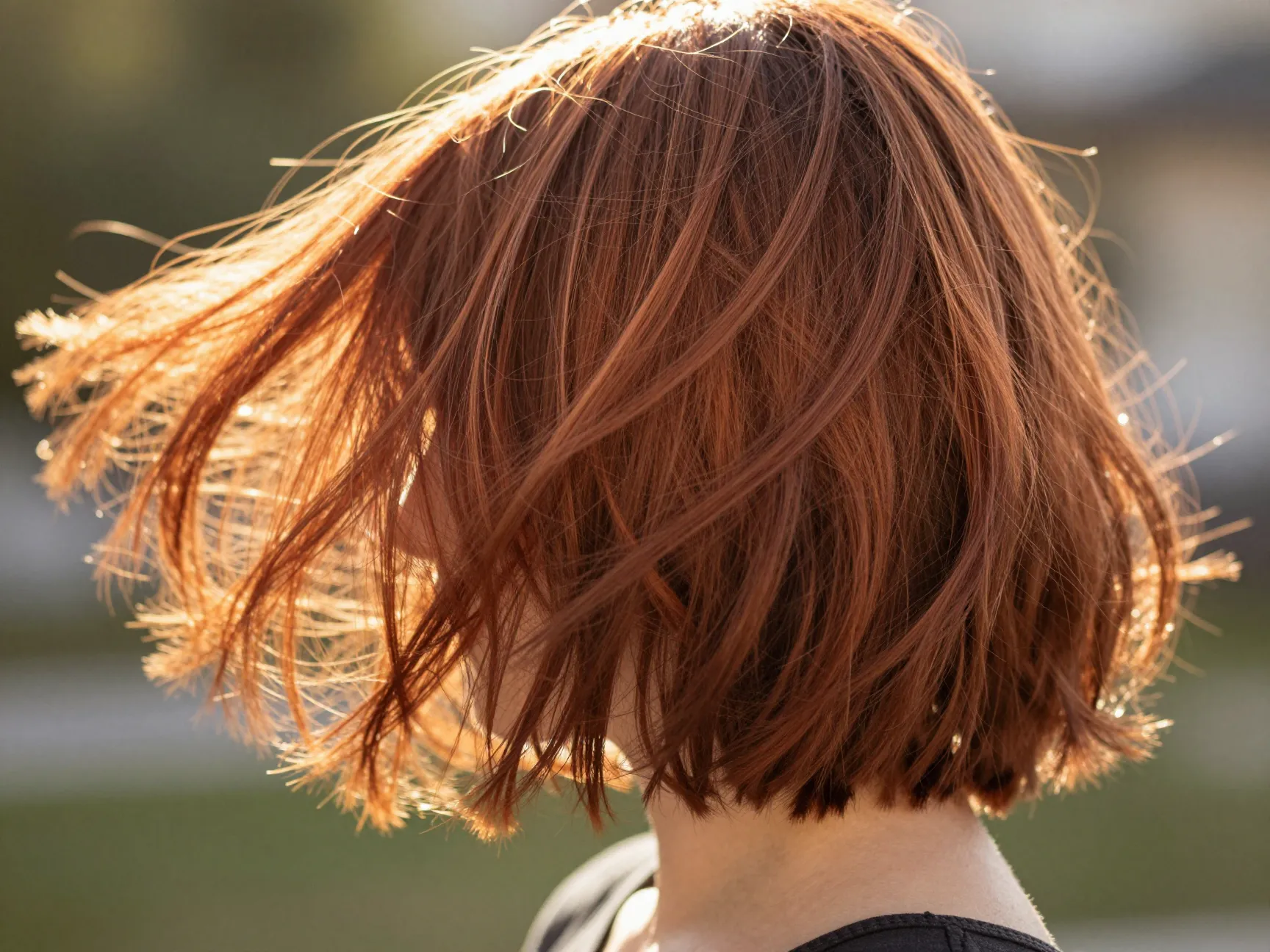 Copper balayage on shaggy bob with sun kissed dimension