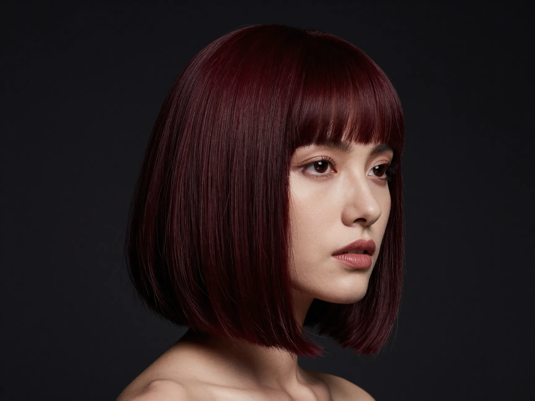 Burgundy blunt bob with rich moody red tones