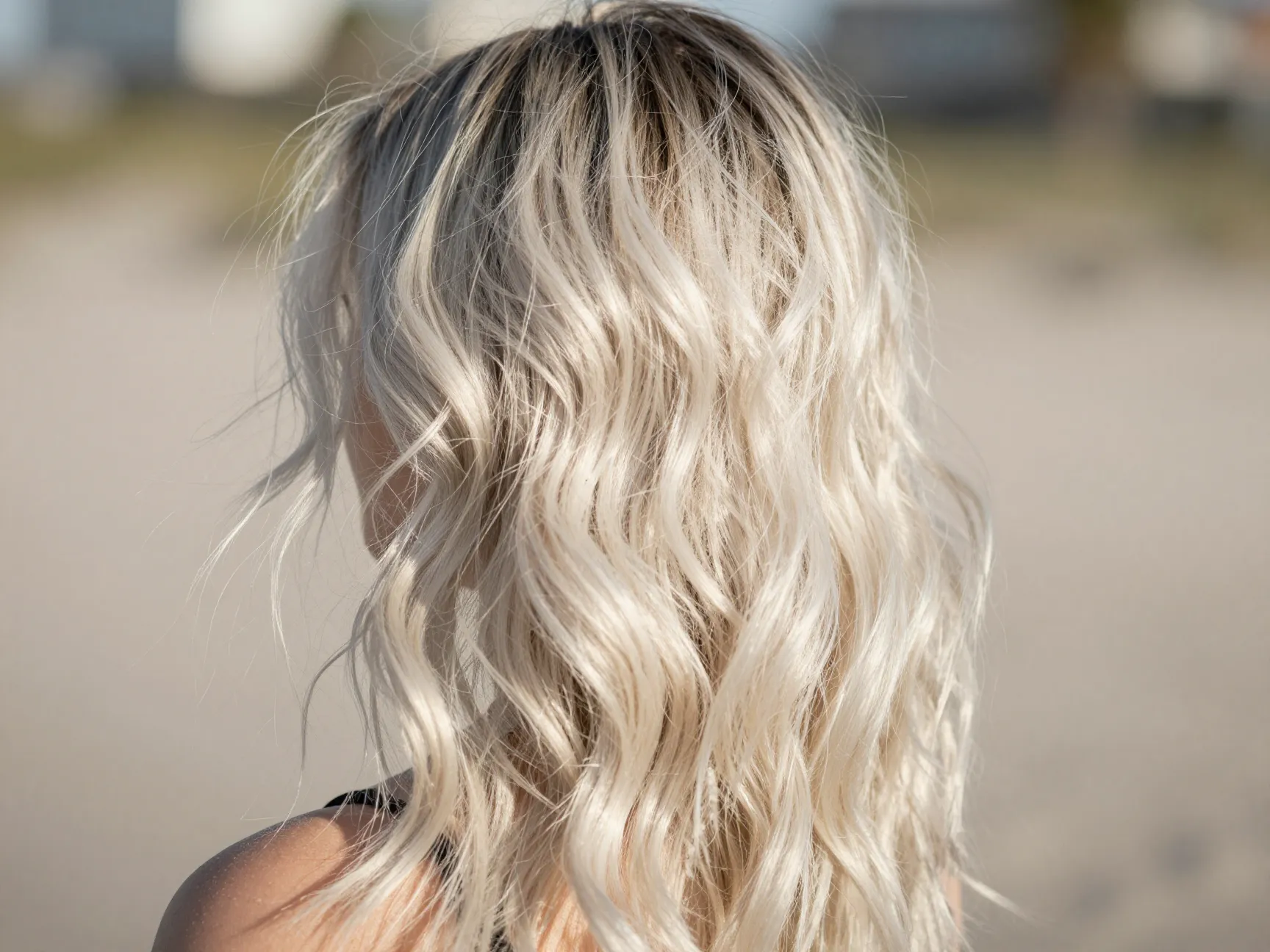 Textured beachy platinum waves with root shadow depth