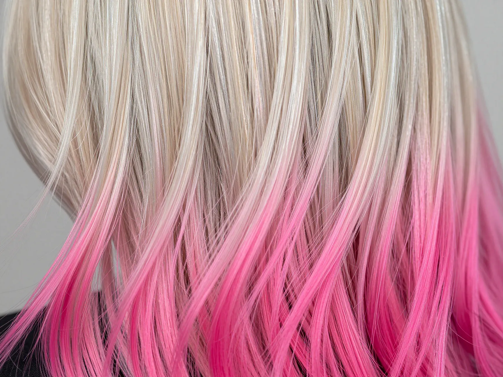 Metallic color melted hair in chrome blonde and electric fuchsia