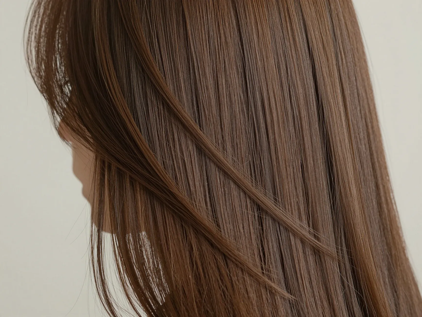 Light layers adding subtle movement to fine long straight hair