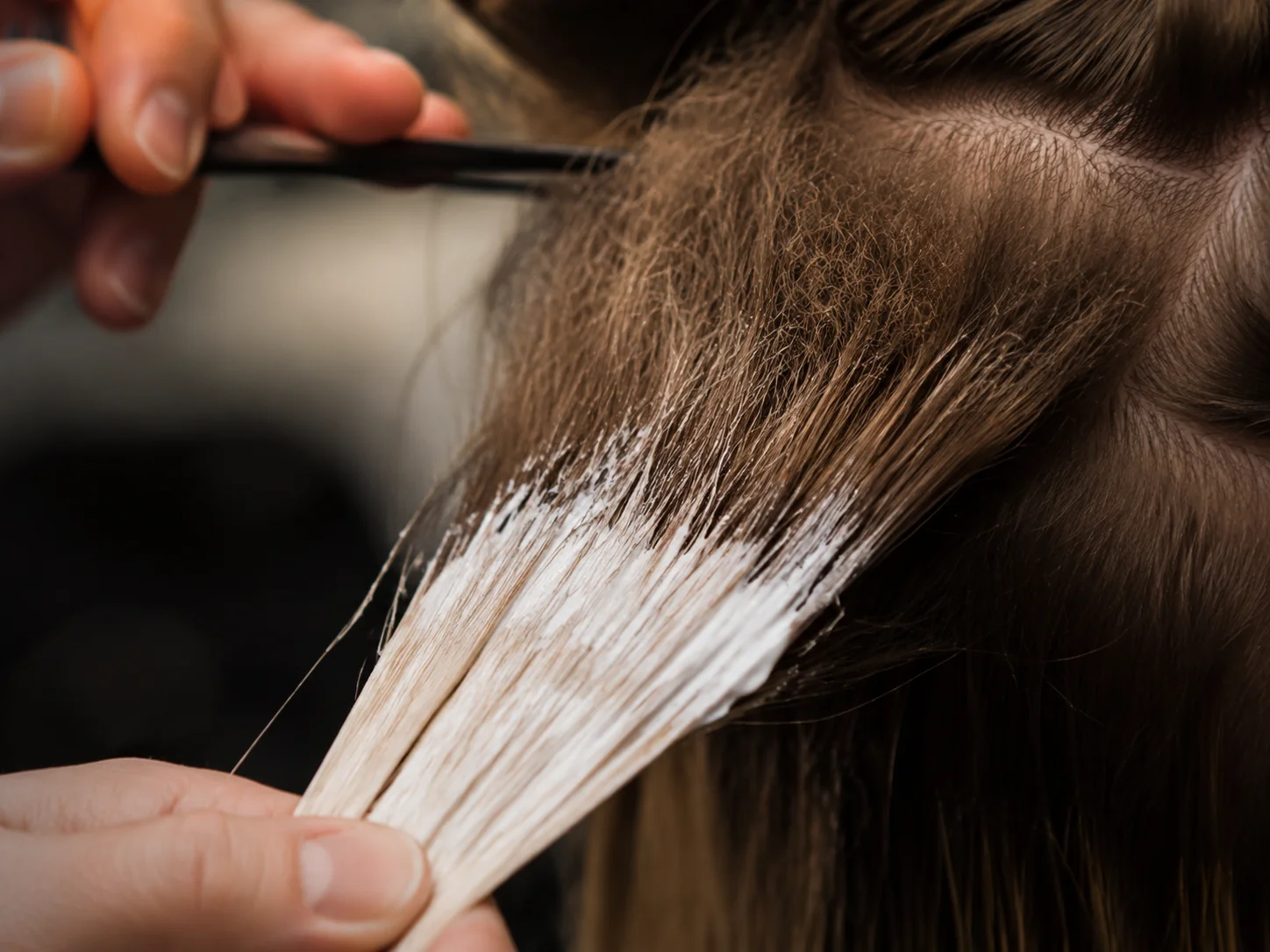 Tease back root melt method with backcombed hair and lightener