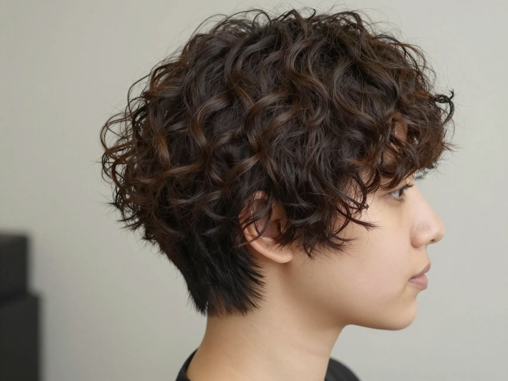 Soft curly pixie longer crown tapered sides texture