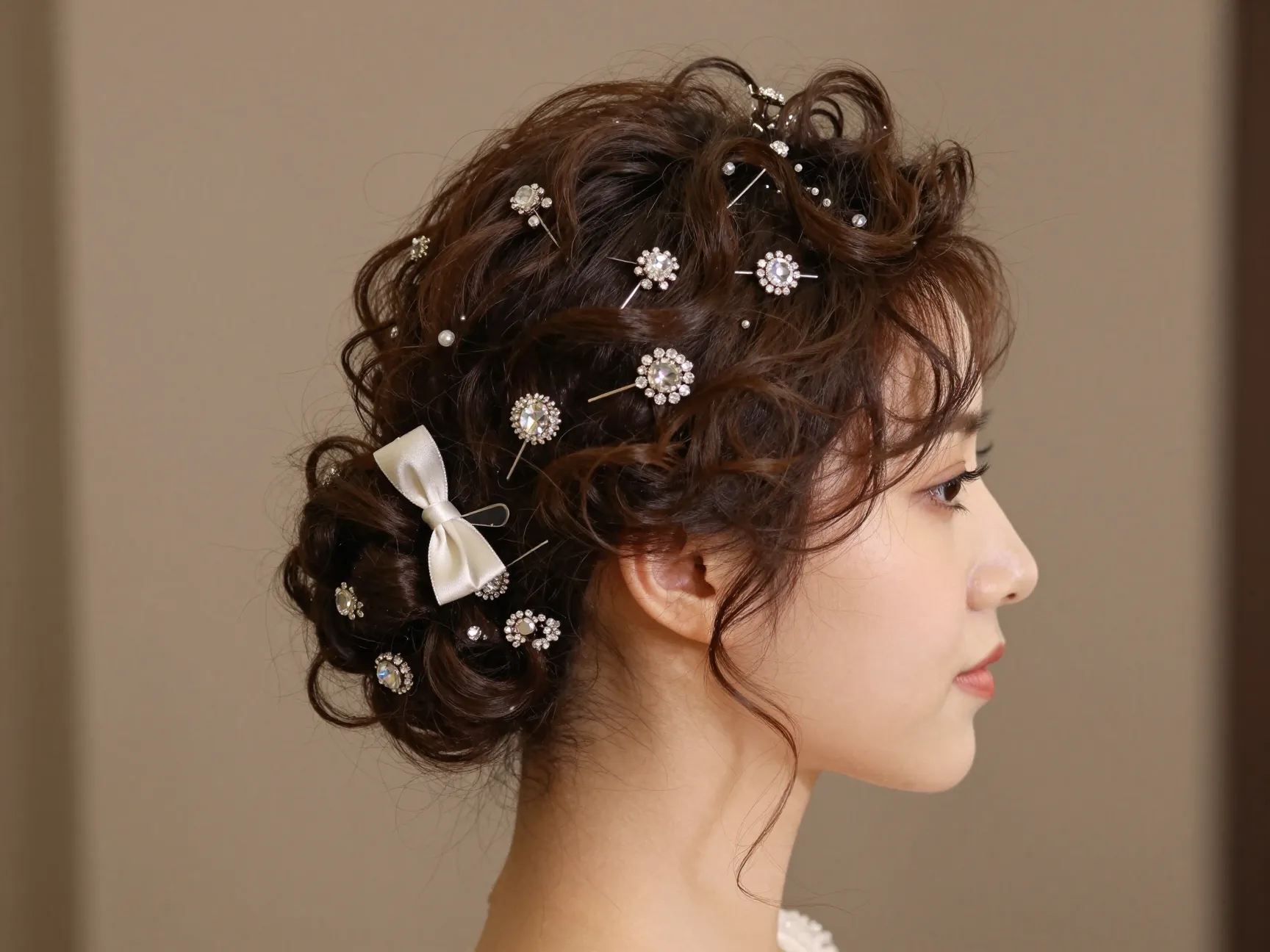 Pinned up short curly style jeweled accessories formal