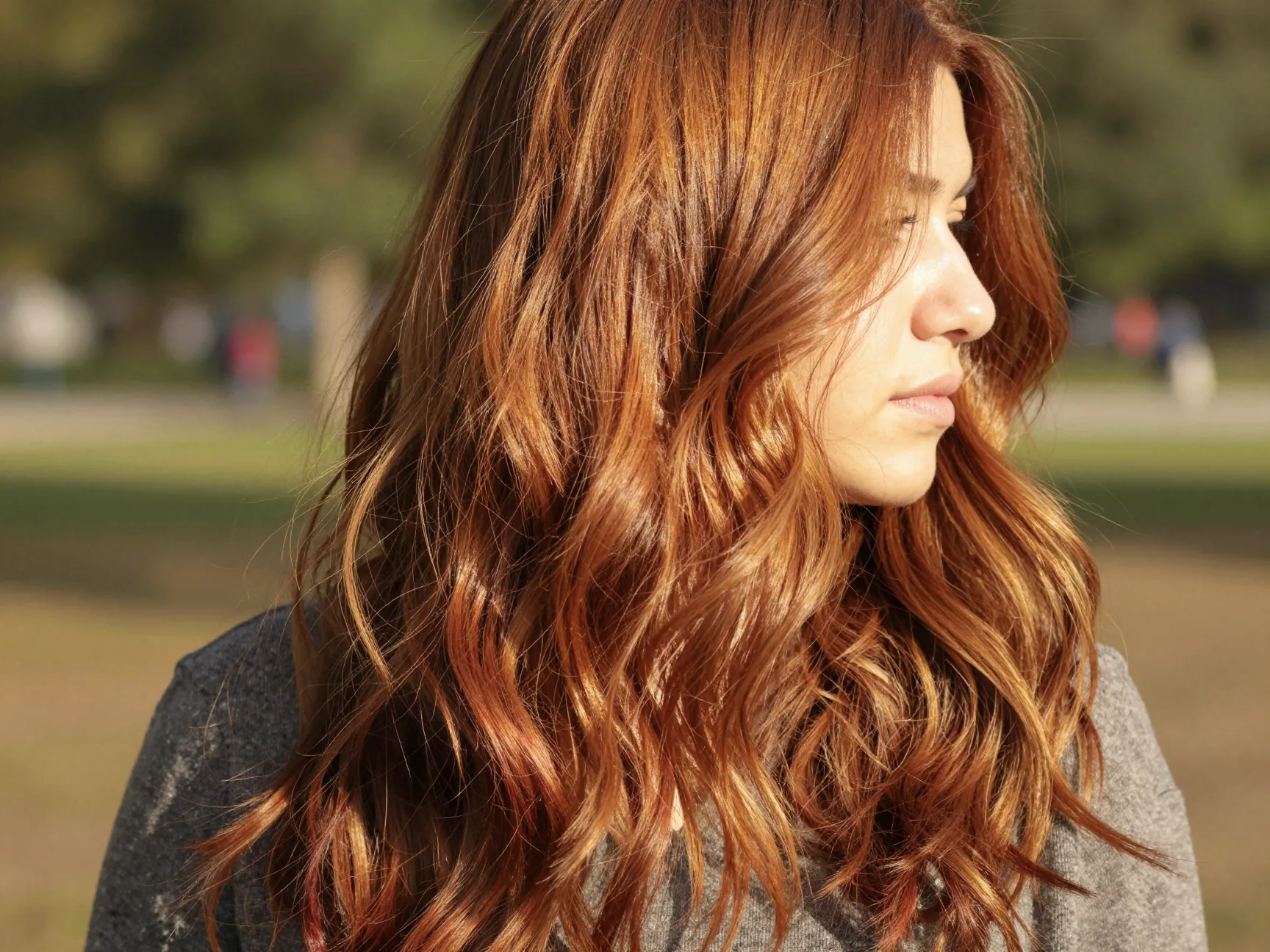 Mocha cherry hair features warm golden brown base with soft cherry balayage