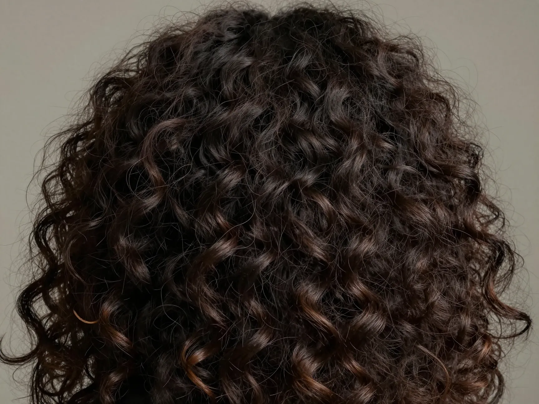 Long romantic curly hair with strategic product placement and frizzy halo