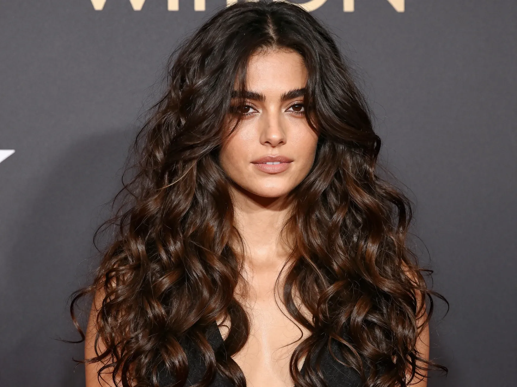 Long layered curly cut with face framing layers formal event