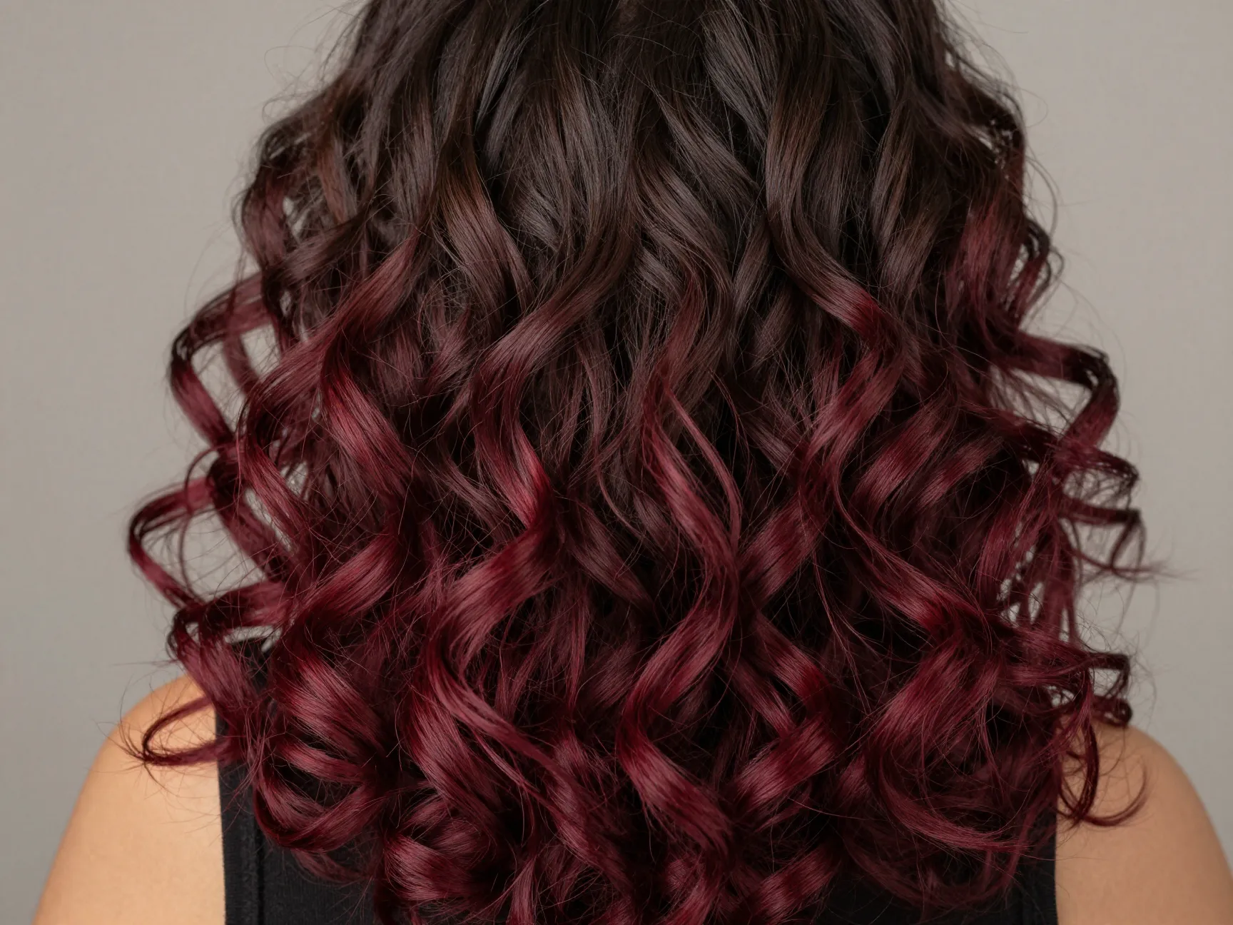 Havana curls with burgundy ombre color transition from dark roots