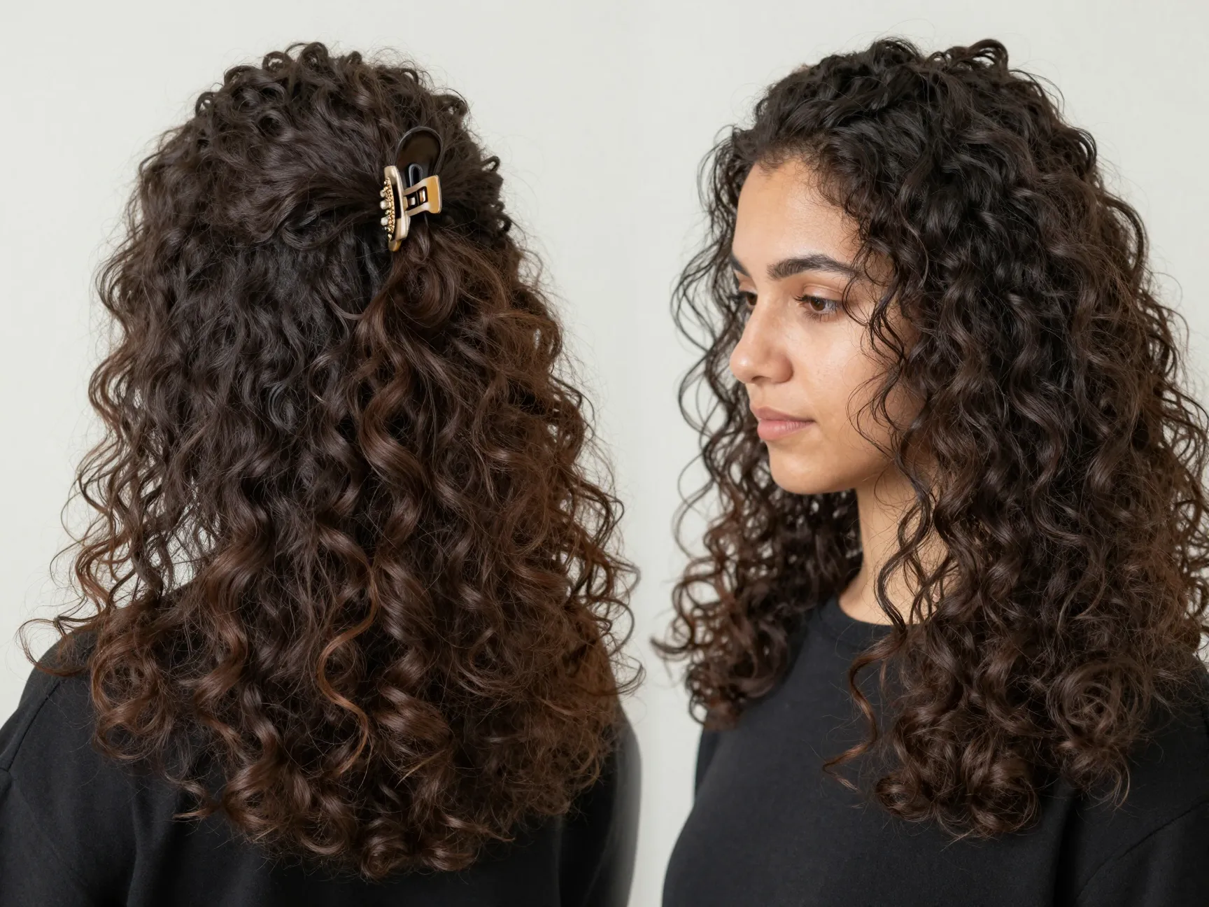 Half up half down curly style with top section secured by a claw clip