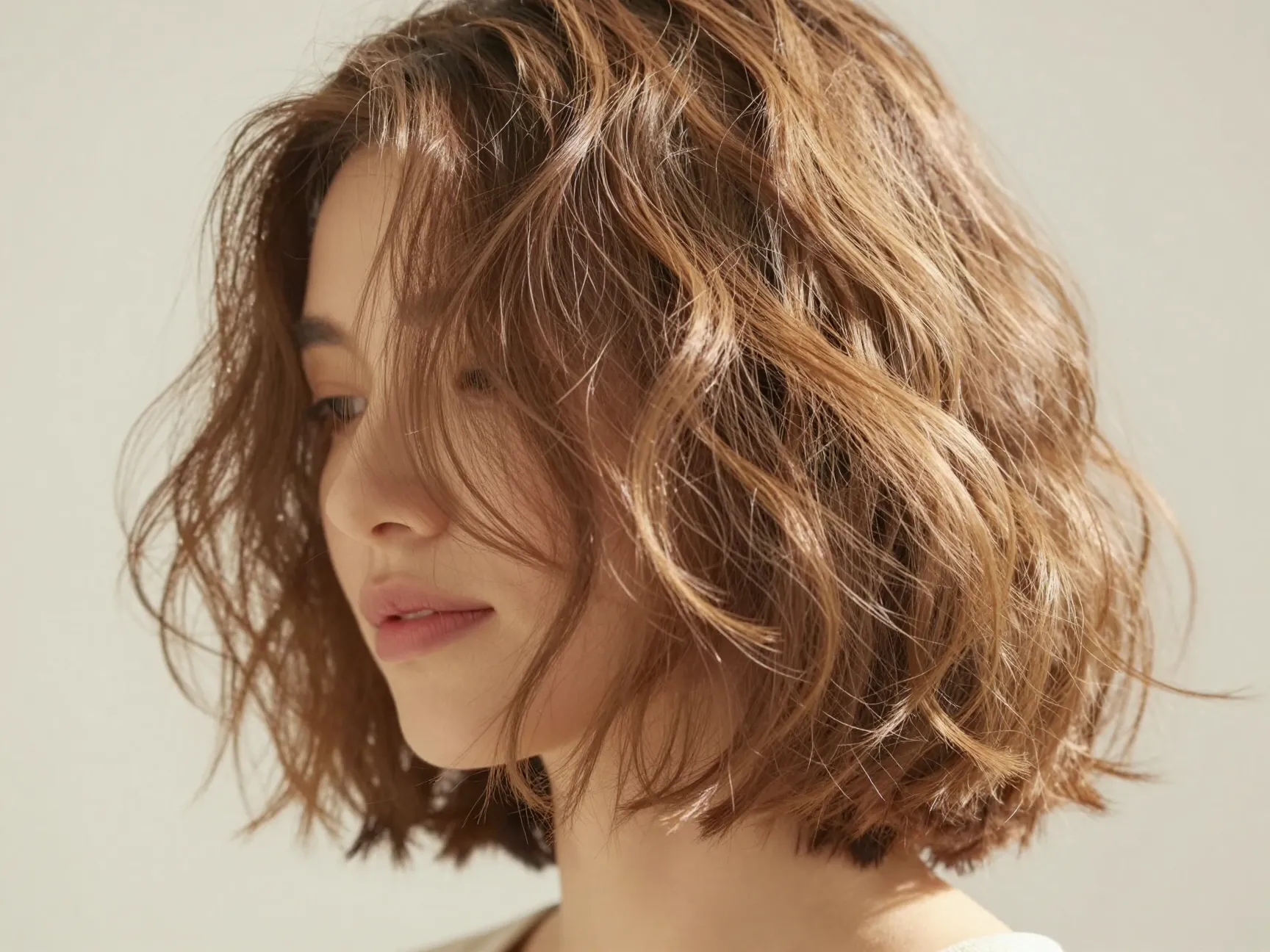 Bouncy tousled bob with loose beachy waves and volume