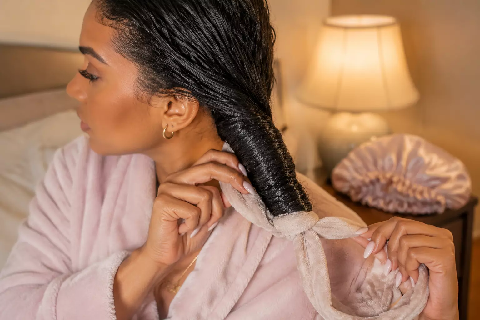 Wrapping damp hair with robe belt heatless curls technique