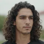 9 Handsome Long Curly Hairstyles for Men to Try This Year
