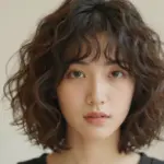 9 Cute & Effortless Hairstyles for Short Curly Hair